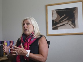 In this Aug. 8, 2017 photo, Paige Flink, CEO of the Family Place, talks about her organization men's shelter in Dallas. The Texas group has opened what's believed to be only the second shelter in the U.S. exclusively for men who are victims of domestic violence, as advocates say more men are seeking help amid changing views about male victims. (AP Photo/LM Otero)