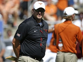 Texas head coach Tom Herman walks the field before playing Oklahoma in an NCAA college football game Saturday, Oct. 14, 2017, in Dallas, Texas. (AP Photo/Ron Jenkins)