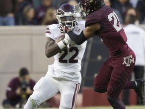 Mississippi State running back Aeris Williams (22) fights off Texas A&M defensive back Charles Oliver (21) during the first quarter of an NCAA college football game on Saturday, Oct. 28, 2017, in College Station, Texas. (AP Photo/Sam Craft)