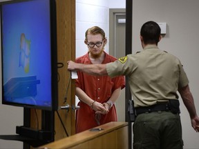 FILE - In this Aug. 23, 2017, file photo, defendant Tyerell Przybycien returns to court following a break during his preliminary hearing, in 4th District Court, Provo, Utah.  A judge ruled ruled Tuesday, Oct. 17, that Przybycien, who was accused of encouraging a teen friend to hang herself and filming it because he was fascinated with death, should stand trial on a murder charge. (Scott Sommerdorf/The Salt Lake Tribune via AP, File)