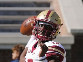 Boston College quarterback Anthony Brown (13) warms up prior to the start of an NCAA college football game against Virginia in Charlottesville, Va., Saturday, Oct. 21, 2017. (AP Photo/Steve Helber)