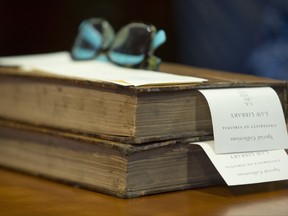 This Friday, June 30, 2017 shows a rare book at the University of Virginia School of Law rare books collection Charlottesville, Va. Nearly 200 years ago, Thomas Jefferson came up with a legal reading list for lawyers. Now, the University of Virginia is putting those books online. (AP Photo/Steve Helber)