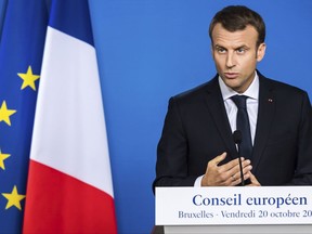 French President Emmanuel Macron speaks during a media conference at the conclusion of an EU summit in Brussels on Friday, Oct. 20, 2017. European Union leaders gathered Friday to weigh progress in negotiations on Britain's departure from their club as they look for new ways to speed up the painfully slow moving process. (AP Photo/Geert Vanden Wijngaert)