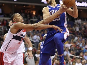 Philadelphia 76ers guard Ben Simmons (25) goes to the basket against Washington Wizards forward Otto Porter Jr. (22) during the first half of an NBA basketball game, Wednesday, Oct. 18, 2017, in Washington. (AP Photo/Nick Wass)