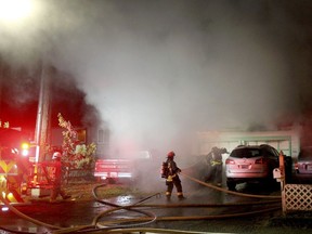 Firefighters work the scene of a deadly house fire Saturday, Oct. 14, 2017, in Port Orchard, Wash. Two adults and 2 small children are dead after fire roared through a two-story home in a Seattle-area town early Saturday.  The Kitsap Sun reports that sheriff's deputies said a man in his 60s escaped the flames in the Port Orchard home and was treated at a hospital. (Larry Steagall/Kitsap Sun via AP)
