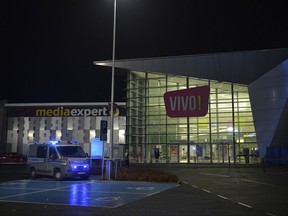 Police are seen in front of the VIVO! shopping mall where a knife attack took place, in Stalowa Wola, southeastern Poland, Friday, Oct. 20, 2017. Police in Poland say there are no terror or political motives for a knife attack at a shopping mall that left one person dead and nine injured. Police say shoppers detained the alleged attacker, a 27-year-old local man, until police could arrive. (AP Photo)