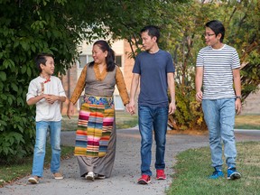 Displaced from Tibet, Namgyal Tsering, second from right, and his family, from left, Tenzin Gurmey, Wangdu Ihamo and Tenzin Kunga, came to Canada from India.