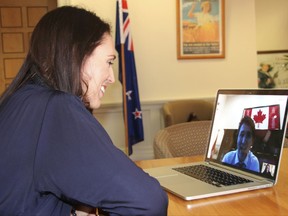In this photo provided by the Labour Party, New Zealand Prime Minister-designate Jacinda Ardern takes a Skype call from Canadian Prime Minister Justin Trudeau in Wellington, Tuesday, Oct. 24, 2017. Ardern, 37, will be New Zealand's youngest leader in more than 150 years when swears in on Thursday Oct. 26, and hopes to take the country on a more liberal path following nine years of rule by the conservatives. (New Zealand Labour Party via AP)