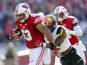 Wisconsin linebacker T.J. Edwards returns an interception for a touchdown against Maryland wide receiver Jahrvis Davenport during the first half of an NCAA college football game Saturday, Oct. 21, 2017, in Madison, Wis. (AP Photo/Andy Manis)