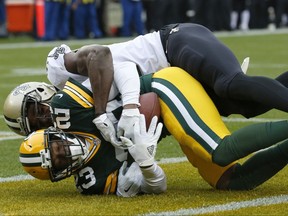 Green Bay Packers cornerback Damarious Randall (23) intercepts a pass intended for New Orleans Saints wide receiver Brandon Coleman (16) during the first half of an NFL football game, Sunday, Oct. 22, 2017, in Green Bay, Wis. (AP Photo/Mike Roemer)