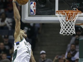 Milwaukee Bucks' Giannis Antetokounmpo way up for a dunk against Oklahoma City Thunder during the first half of an NBA basketball game Tuesday, Oct. 31, 2017, in Milwaukee. (AP Photo/Tom Lynn)