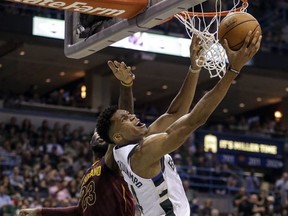 Milwaukee Bucks' Giannis Antetokounmpo shoots over Cleveland Cavaliers LeBron James during the second half of an NBA basketball game Friday, Oct. 20, 2017, in Milwaukee. (AP Photo/Tom Lynn)