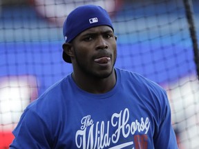 Los Angeles Dodgers right fielder Yasiel Puig watches during batting practice for baseball's World Series against the Houston Astros, Monday, Oct. 23, 2017, in Los Angeles. (AP Photo/David J. Phillip)