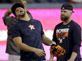 Houston Astros center fielder George Springer laughs during batting practice for baseball's World Series against the Los Angeles Dodgers Monday, Oct. 23, 2017, in Los Angeles. (AP Photo/David J. Phillip)