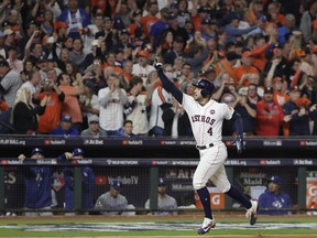 Houston Astros' George Springer celebrates after hitting a home run during the sixth inning of Game 4 of baseball's World Series against the Los Angeles Dodgers Saturday, Oct. 28, 2017, in Houston. (AP Photo/Matt Slocum)