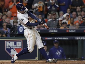 Houston Astros' George Springer hits a home run during the seventh inning of Game 5 of baseball's World Series against the Los Angeles Dodgers Sunday, Oct. 29, 2017, in Houston. (AP Photo/David J. Phillip)