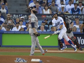 Los Angeles Dodgers' Chris Taylor, right, watches his home run off Houston Astros starting pitcher Dallas Keuchel during the first inning of Game 1 of baseball's World Series Tuesday, Oct. 24, 2017, in Los Angeles.(AP Photo/Mark J. Terrill)