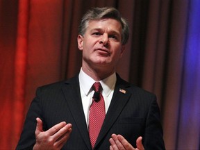 FILE - In this Oct. 22, 2017, file photo, FBI Director Christopher Wray speaks at the International Association of Chiefs of Police annual conference in Philadelphia. The FBI's use of foreign intelligence is at the heart of a heated debate about reauthorizing a law that lets spy agencies collect information on non-U.S. citizens abroad. The Foreign Intelligence Surveillance Amendments Act is set to expire Dec. 31.  (AP Photo/Michael Balsamo, File)