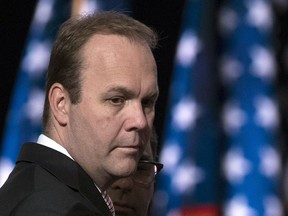 FILE - In this July 21, 2016 file photo, Rick Gates, campaign aide to Republican presidential candidate Donald Trump, at the Republican National Convention in Cleveland. Trump's former campaign chairman, Paul Manafort, and a former business associate, Rick Gates, have been told to surrender to federal authorities Monday, according to reports and a person familiar with the matter.(AP Photo/Evan Vucci, File)