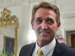 In this photo taken July 19, 2017, Sen. Jeff Flake, R-Ariz. walks to his seat as he attends a luncheon with other GOP Senators and President Donald Trump at the White House in Washington. Flake, a frequent critic of President Donald Trump, announced on Oct. 24, he won't seek re-election. (AP Photo/Pablo Martinez Monsivais, File)