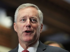 In this July 19, 2017 photo, Freedom Caucus Chairman Rep. Mark Meadows, R-S.C., speaks to reporters on Capitol Hill in Washington.  Congress is full of surprises these days. So why shouldn't hard-right Rep. Mark Meadows, the head of the House Freedom Caucus, and top Senate Democrat Chuck Schumer talk taxes? The North Carolina Republican popped in to see Schumer, a New York Democrat, on Wednesday.  (AP Photo/Manuel Balce Ceneta)