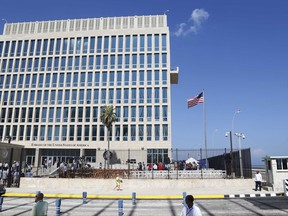 FILE - In this Aug. 14, 2015, file photo, a U.S. flag flies at the U.S. embassy in Havana, Cuba. The Associated Press has obtained a recording of what some U.S. Embassy workers heard in Havana, part of the series of unnerving incidents later deemed to be deliberate attacks.   (AP Photo/Desmond Boylan, File)