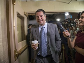 FILE - In this July 28, 2017, file photo, House Intelligence Committee Chairman Rep. Devin Nunes, R-Calif., walks on Capitol Hill in Washington. A political research firm behind a dossier of allegations about President Donald Trump's connections to Russia has been subpoenaed by the House intelligence committee. Joshua Levy, a lawyer for Fusion GPS, said in a statement Ton Oct. 10 that the subpoenas were signed by Nunes even though the Republican committee chairman stepped aside months ago from leading the panel's Russia probe. (AP Photo/J. Scott Applewhite, File)