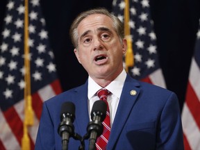 In this Aug. 16, 2017 photo, Veterans Affairs Secretary David Shulkin speaks during a press briefing in Bridgewater, N.J. The Department of Veterans Affairs has abruptly dropped plans to suspend an ethics law barring employees from receiving benefits from for-profit colleges. The move comes after criticism from government watchdogs, who warned of financial entanglements between government and the private companies vying for millions in GI Bill tuition. In a statement to The Associated Press, the VA said it had received "constructive comments" and as a result would delay action.   (AP Photo/Pablo Martinez Monsivais)