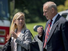 In this Aug. 22, 2017 photo, White House Chief of Staff John Kelly and Deputy Chief of Staff Kirstjen Nielsen speak together as they walk across the South Lawn of the White House in Washington. President Donald Trump is expected to nominate Kirstjen Nielsen as his next Secretary of Homeland Security. That's according to three people familiar with decision. They spoke on condition of anonymity in order to discuss deliberations before a formal announcement. Nielsen was former DHS Secretary John Kelly's deputy when he served in that role and moved with Kelly to the White House when he was tapped to be Trump's chief of staff.   (AP Photo/Andrew Harnik)