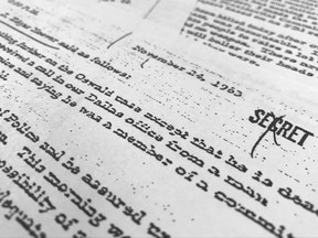 Part of a file, dated Nov. 24, 1963, quoting FBI director J. Edgar Hoover as he talks about the death of Lee Harvey Oswald, released for the first time on Thursday, Oct. 26, 2017,  is photographed in Washington. The public is getting a look at thousands of secret government files related to President John F. Kennedy's assassination, but hundreds of other documents will remain under wraps for now. The government was required by Thursday to release the final batch of files related to Kennedy's assassination in Dallas on Nov. 22, 1963. But President Donald Trump delayed the release of some of the files, citing security concerns. (AP Photo/Jon Elswick)