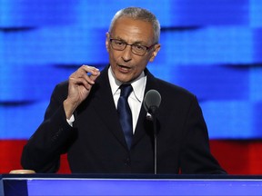 FILE - In this July 25, 2016, file photo, John Podesta, Clinton campaign chairman, speaks during the first day of the Democratic National Convention in Philadelphia. The indictment that alleges covert foreign lobbying by two former Trump campaign officials is casting shadows on three powerful Washington lobbying and legal firms, with Democratic as well as Republican ties, broadening the stakes of the Russia investigation to both parties and drawing in Tony Podesta, the brother of Hillary Clinton's campaign chairman. (AP Photo/J. Scott Applewhite, File)