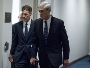 FILE - In this June 21, 2017, file photo, special counsel Robert Mueller departs Capitol Hill following a closed door meeting in Washington. Mueller's team of investigators has recently questioned a former British spy who compiled a dossier of allegations about President Donald Trump's ties to Russia. (AP Photo/Andrew Harnik)