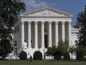 FILE - In this June 26, 2017, file photo, the Supreme Court is seen in Washington. The Supreme Court is taking up a case about political maps in Wisconsin that could affect elections across the country. The justices are hearing argument on Oct. 3 in a dispute between Democratic voters and Wisconsin Republicans who drew maps that have entrenched their control of the legislature in a state that is otherwise closely divided between the parties.  (AP Photo/J. Scott Applewhite, File)