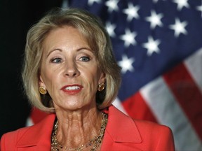 FILE - In this Sept. 7, 2017, file photo, Education Secretary Betsy DeVos speaks at George Mason University Arlington, Va., campus. Students who attended for-profit colleges were twice as likely or more to default on their loans than students who attended public schools, according to a new federal study. The report comes as Education Secretary Betsy DeVos rewrites rules that had been put in place by the Obama administration to protect students who said they were defrauded by their for-profit colleges. (AP Photo/Jacquelyn Martin, File)