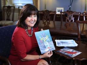 Karen Pence, wife of Vice President Mike Pence, shows her artwork during an interview with The Associated Press in her office at the Eisenhower Executive Office Building on the White House complex in Washington, Tuesday, Oct. 17, 2017. Pence is using her platform as the vice president's wife to raise awareness about art therapy, a mental health field she's been passionate about for a decade but says is unknown to many. "I don't think that a lot of people understand the difference between therapeutic art and art therapy," Mrs. Pence, a trained watercolor artist, told The AP in an exclusive interview before she visits Florida on Wednesday to outline her vision for her art therapy initiative. (AP Photo/Manuel Balce Ceneta)