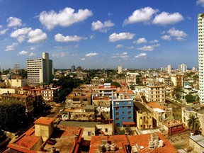 This image provided by Chris Allen shows the view in Havana, Cuba, from his hotel room - room 1414 - at Hotel Capri in April 2014. Allen's phone started buzzing as word broke of invisible attacks hitting a U.S. government worker at Havana's Hotel Capri. Allen's friends and family had heard an eerily similar story from him before. The tourist from South Carolina had cut short his trip to Cuba two years earlier after numbness spread through all four of his limbs, just minutes after he climbed into bed at the same hotel. Those weren't the only parallels in Allen's recounting, which put him in a growing list of Americans with no government connections, asking the same alarming but unanswerable question: Were we victims, too? (Chris Allen via AP)