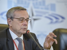 President of the NATO Parliamentary Assembly, Paolo Alli gestures during a press briefing marking the opening of the 63rd Annual Session of the NATO Parliamentary Assembly in Bucharest, Romania, Friday, Oct. 6, 2017. A top NATO official says the alliance is concerned about an increase in terrorism in Afghanistan after NATO withdrew its combat troops in 2014. (AP Photo/Andreea Alexandru)