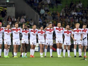 England players line before the start of during Rugby League World Cup game against Australia in Melbourne, Australia, Friday, Oct. 27, 2017. (AP Photo/Andy Brownbill)