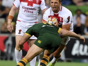 England's Samuel Burgess is tackled by Australia's Boyd Cordner during their Rugby League World Cup game in Melbourne, Australia, Friday, Oct. 27, 2017. (AP Photo/Andy Brownbill)