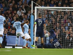 Manchester City's Raheem Sterling, second from left, scores a goal during the Champions League group F soccer match between Manchester City and Napoli at the Etihad Stadium in Manchester, England, Tuesday, Oct.17, 2017. (AP Photo/Dave Thompson)