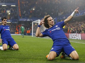 Chelsea's David Luiz, right, celebrates with his teammate Alvaro Morata after scoring during the Champions League group C soccer match between Chelsea and Roma at Stamford Bridge stadium in London, Wednesday, Oct. 18, 2017. (AP Photo/Frank Augstein)