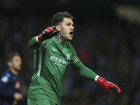 Manchester City goalkeeper Ederson celebrates after saving a penalty kick during the Champions League group F soccer match between Manchester City and Napoli at the Etihad Stadium in Manchester, England, Tuesday, Oct.17, 2017. (AP Photo/Dave Thompson)