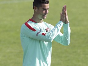 Portugal's Cristiano Ronaldo gestures during a training session in Oeiras, outside Lisbon, Monday, Oct. 9, 2017. Portugal will face Switzerland in a World Cup Group B qualifying soccer match in Lisbon Tuesday. (AP Photo/Armando Franca)