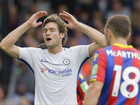Chelsea's Marcos Alonso gestures after missing a chance on goal during their English Premier League soccer match between Crystal Palace and Chelsea at Selhurst Park stadium in London, Saturday, Oct. 14, 2017. Palace won the game 2-1. (AP Photo/Alastair Grant)