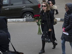 Ksenia Sobchak, 35-year-old Russian celebrity TV host who wants to become a presidential candidate, second right, arrives to attend a ceremony marking the 15th anniversary of the 2002 Chechen gunmen attack on a Moscow Theatre, in Moscow, Russia, Thursday, Oct. 26, 2017. Sobchak has tossed her hat in the ring, but no one knows if she can meet the registration requirements or if she's effectively a red herring. (AP Photo/Ivan Sekretarev)