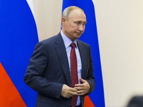 Russian President Vladimir Putin leaves his and Croatia's President Kolinda Grabar-Kitarovic their joint news conference following their talks in the Bocharov Ruchei residence in the Black Sea resort of Sochi, Russia, Wednesday, Oct. 18, 2017. (AP Photo/Alexander Zemlianichenko, Pool)