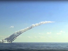 In this frame grab provided on Thursday, Oct. 5, 2017, by Russian Defence Ministry press service, showing what they say is a long-range Kalibr cruise missile launched by the a Russian submarine in the Mediterranean. The Defense Ministry said that two Russian submarines in the Mediterranean fired 10 cruise missiles Thursday at the Islamic State group's positions outside the eastern Syrian town of Mayadeen, one of the last major IS strongholds in the country. (Russian Defence Ministry Press Service photo via AP)