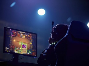 In this photo taken by LAUREL Photo Services on Tuesday, Sept. 26, 2017, an esports competitor takes part in the Asian Indoor and Martial Arts Games in Ashgabat, Turkmenistan. Including competitive computer games, known as esports, could give the Olympics a younger audience and a huge revenue boost from a rapidly growing market, but would be deeply controversial. (David Aliaga/LAUREL Photo Services via AP)