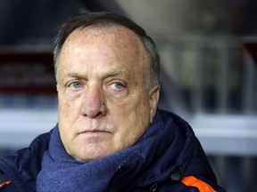 Netherland's coach Dick Advocaat stands on the sidelines ahead of the World Cup Group A qualifying soccer match between Belarus and Netherlands, at the Borisov-Arena stadium, in Borisov, Belarus, Saturday, Oct. 7, 2017. (AP Photo/Sergei Grits)