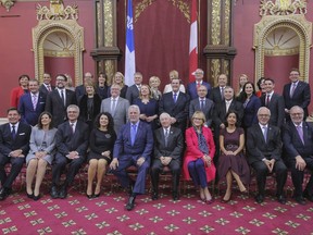 Members of the new Liberal cabinet poses for a photo at the National Assembly in Quebec City on Wednesday October 11, 2017. Quebec Premier Philippe Couillard shuffled his cabinet this morning in a bid to give it a younger look ahead of next year's provincial election.THE CANADIAN PRESS/Francis Vachon.